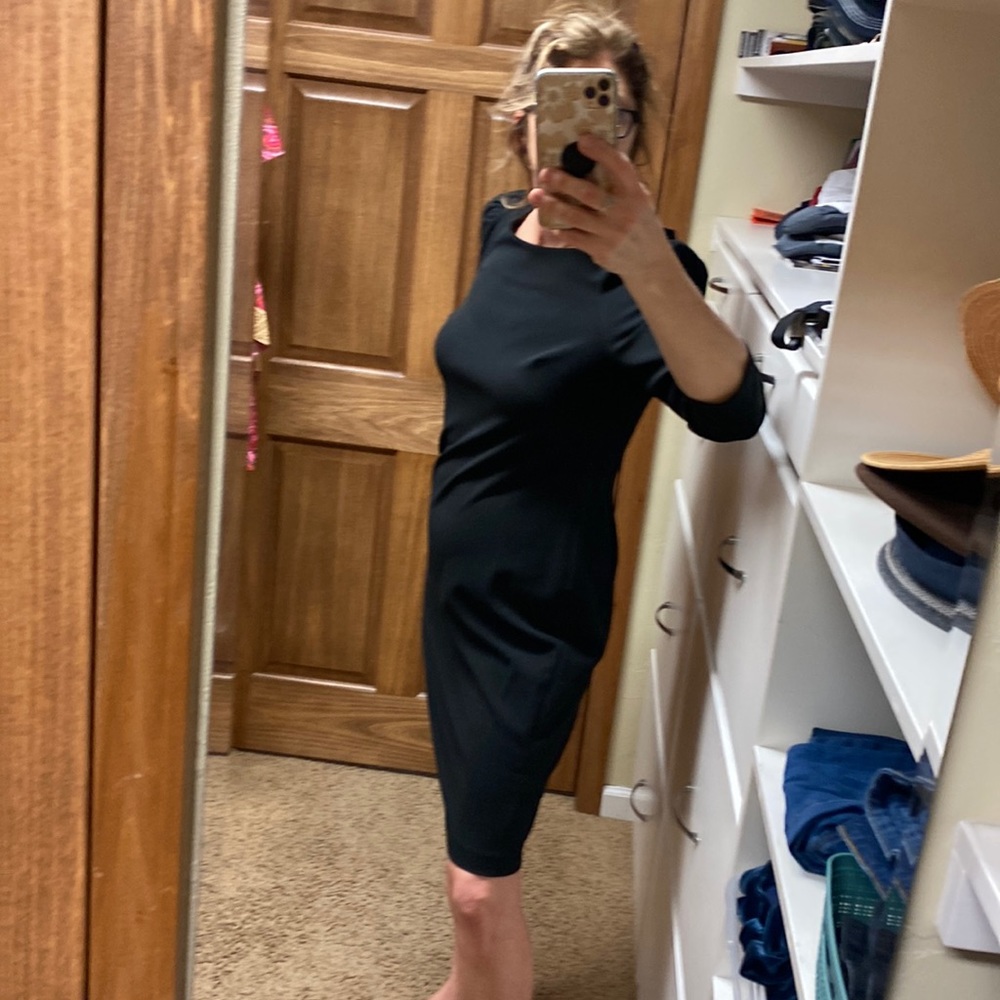 Calvin Klein Black Cocktail dress along sleeve. Size 12.